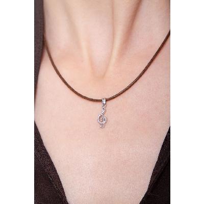 18k white gold treble clef pendant with cubic zirconia