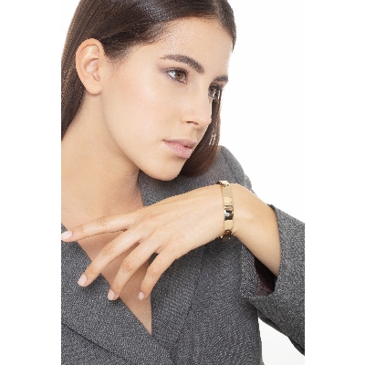 Bracciale rigido in oro giallo 18k con zirconi colorati.