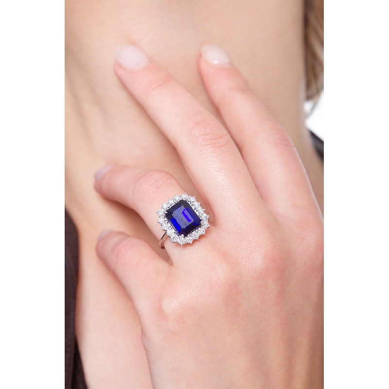 White gold 18k halo ring with blue sapphire emerald cut and diamonds 
