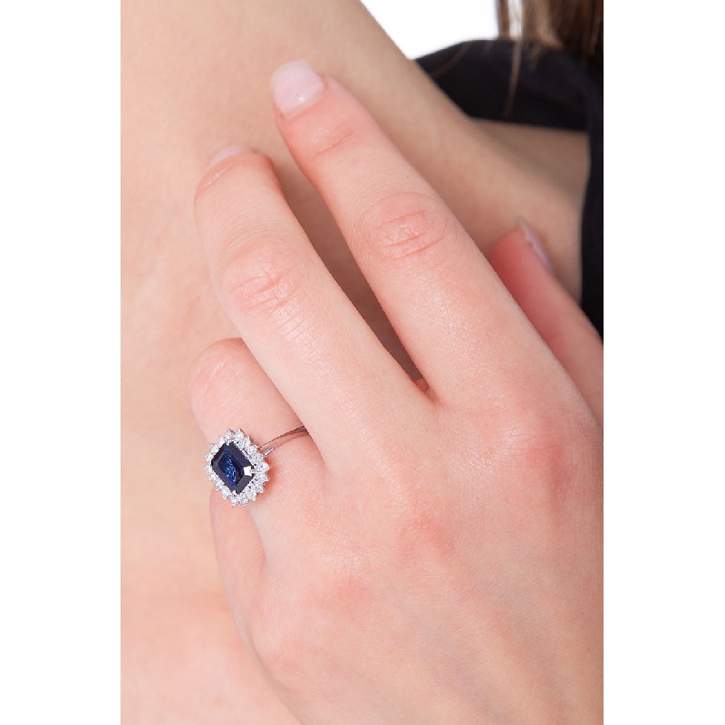 18k white gold halo ring with blue sapphires and diamonds 
