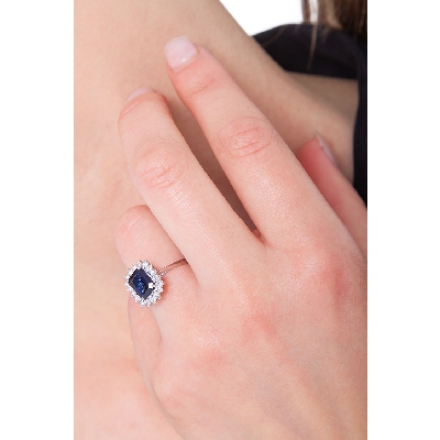 18k white gold halo ring with blue sapphires and diamonds 