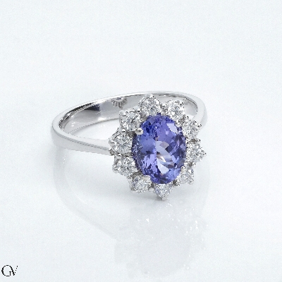 18k white gold halo ring with an oval tanzanite and diamonds