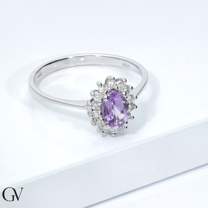 Halo ring with oval cut amethyst and diamonds 