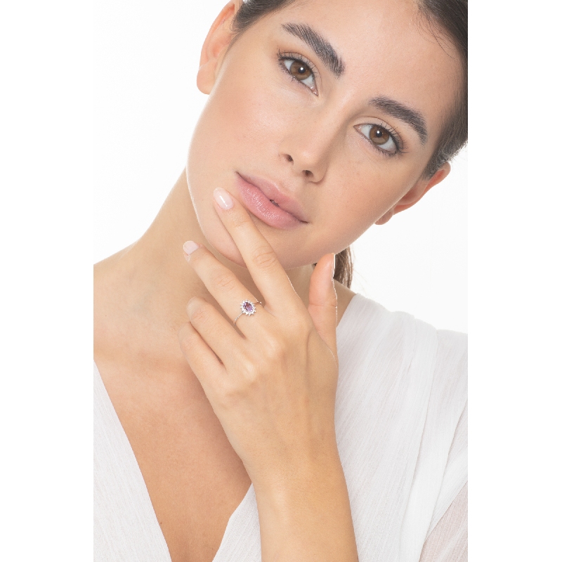 Halo ring with oval cut amethyst and diamonds 