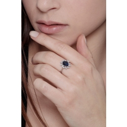 White gold 18k diamond halo ring with a central blue sapphire 2