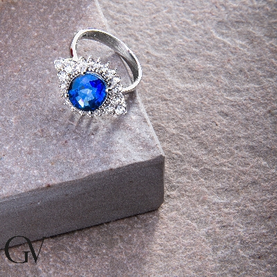 White gold 18k ring with diamonds and an oval cut blue sapphire