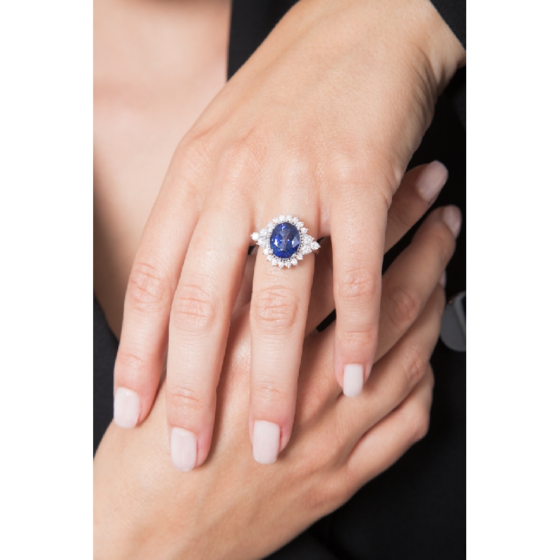 White gold 18k ring with diamonds and an oval cut blue sapphire