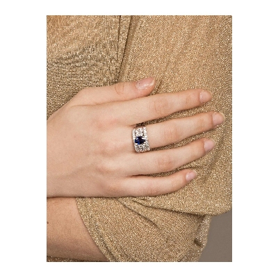 Band ring with diamonds a central blue sapphire