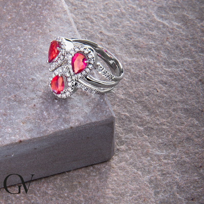 White gold 18k halo ring with diamonds and rubies pear cut