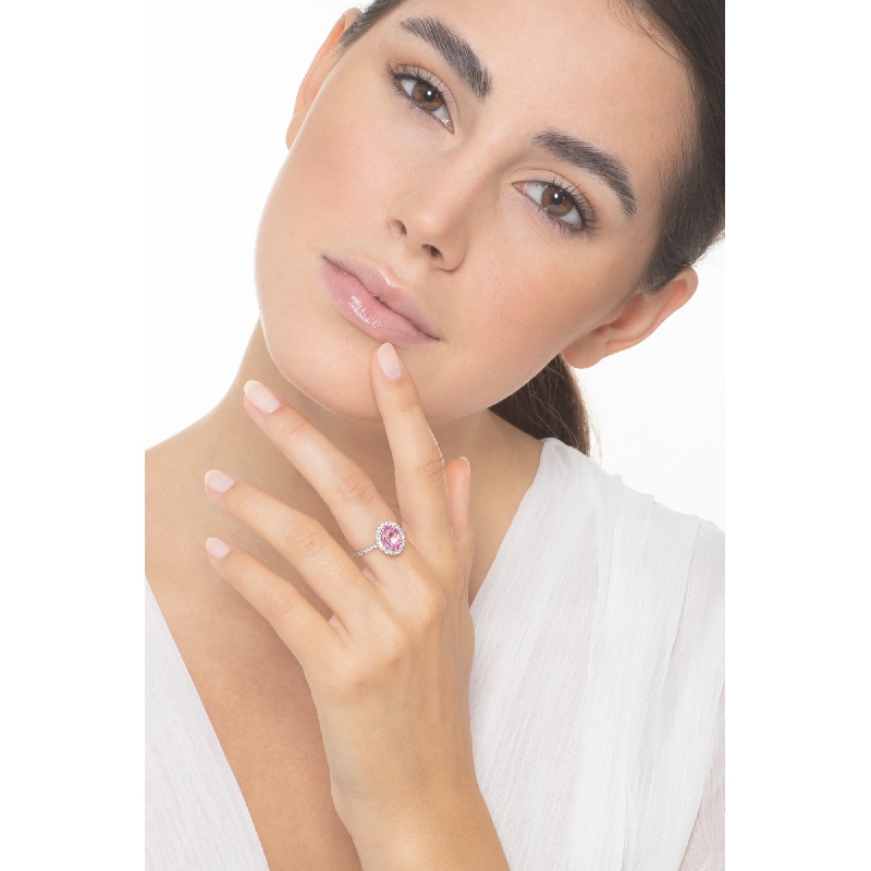 18k white gold halo ring with oval cut pink sapphire and diamond shoulder set