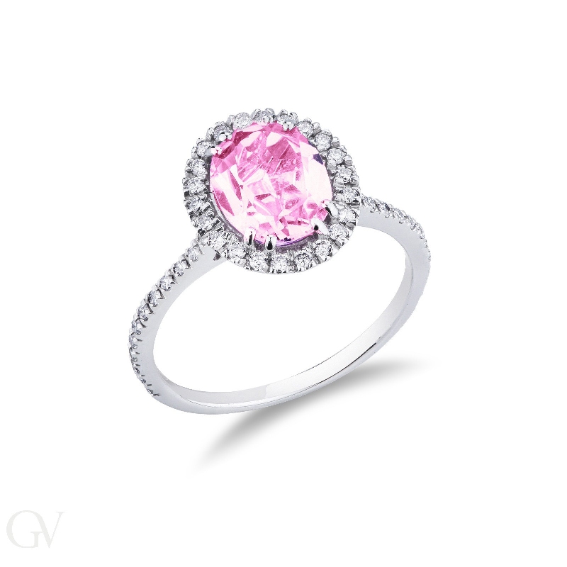 18k white gold halo ring with oval cut pink sapphire and diamond shoulder set