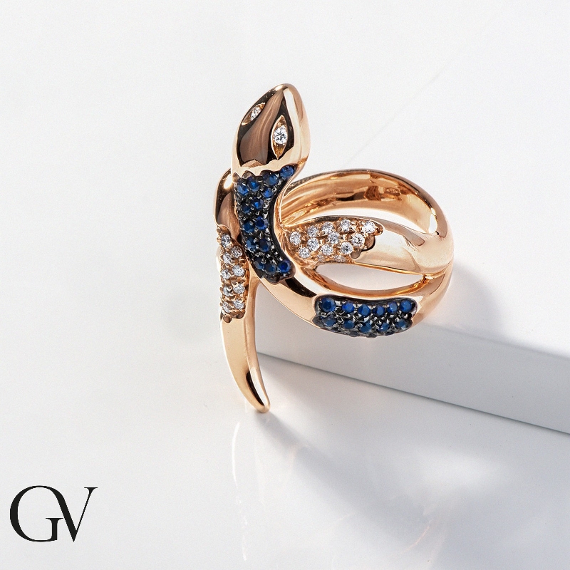 18k rosé gold ring with a diamond snake and blue sapphires 