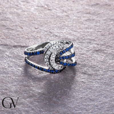 Bow ring in white gold 18k with blue sapphires on burnished tips and diamonds 