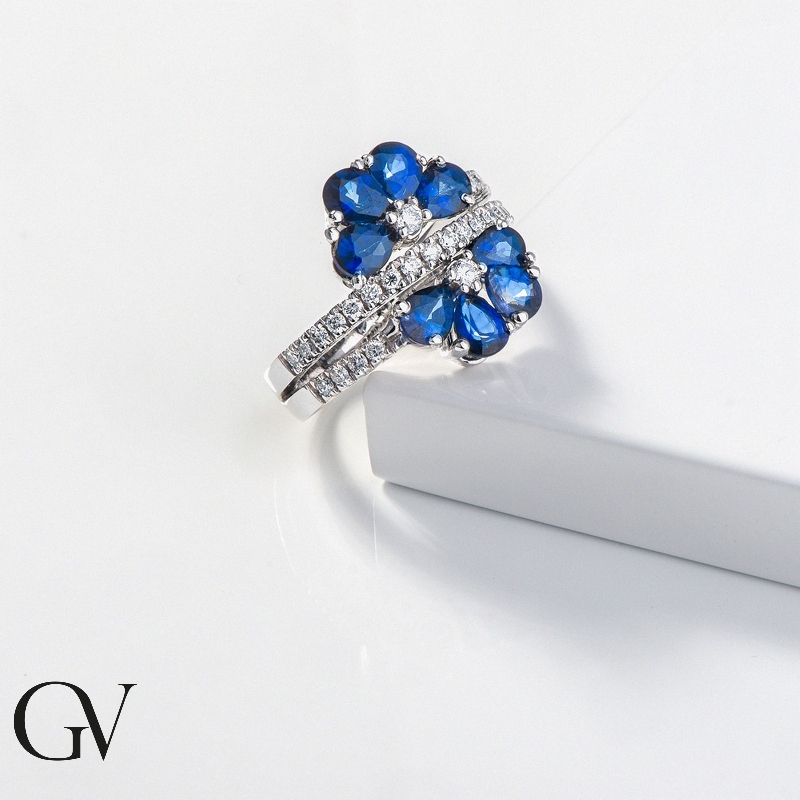 18k white gold flower shaped ring with blue sapphires and diamonds 