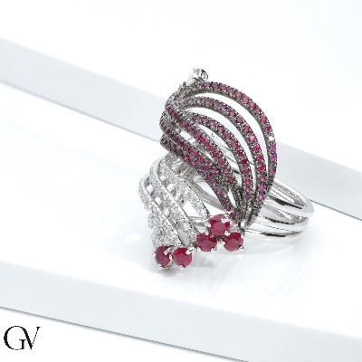 Band ring with rubies on burnished tips and diamonds 