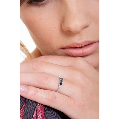 Trilogy ring with black central diamonds and diamond shoulder set