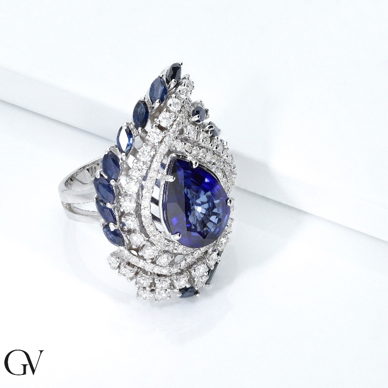 18k white gold halo with blue sapphires pear cut and diamonds