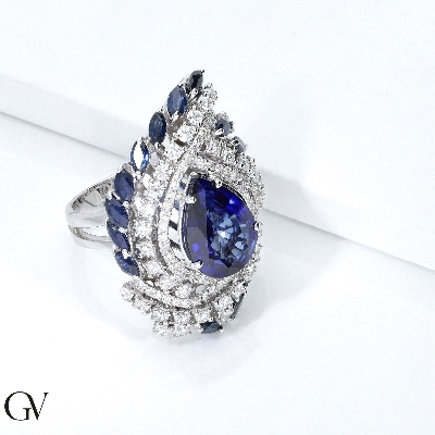 18k white gold halo with blue sapphires pear cut and diamonds