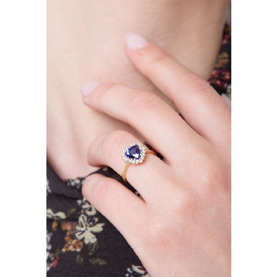 Halo ring with blue sapphire heart cut and diamonds yellow gold 18k