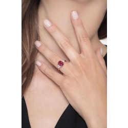 White gold 18k ring with a central ruby and three diamonds per side  2