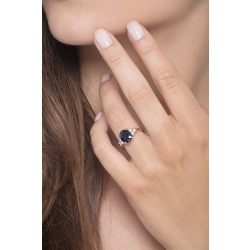 White gold 18k ring with a central blue sapphire and diamonds  2