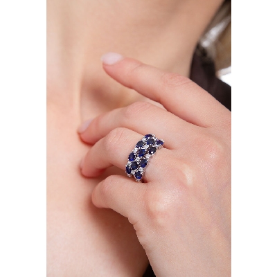 18k white gold ring with three rows of diamonds and blue sapphires 