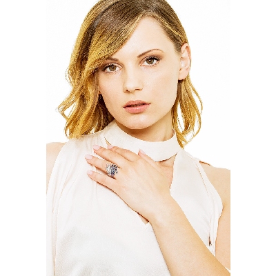 18k white gold ring with waves of blue sapphires and diamonds 