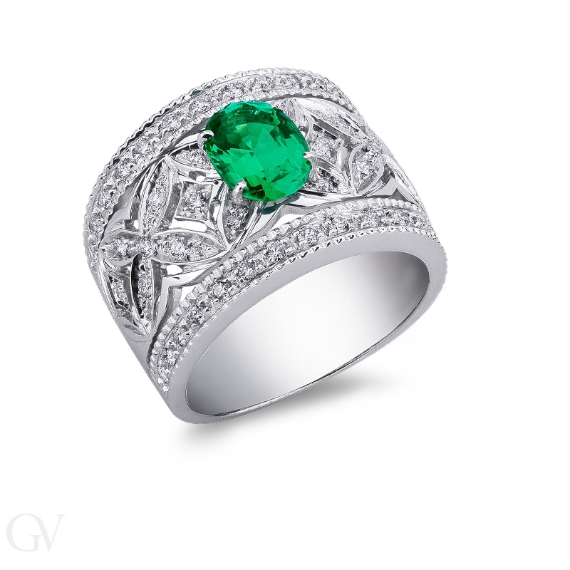 18k white gold band ring with diamonds and a central emerald