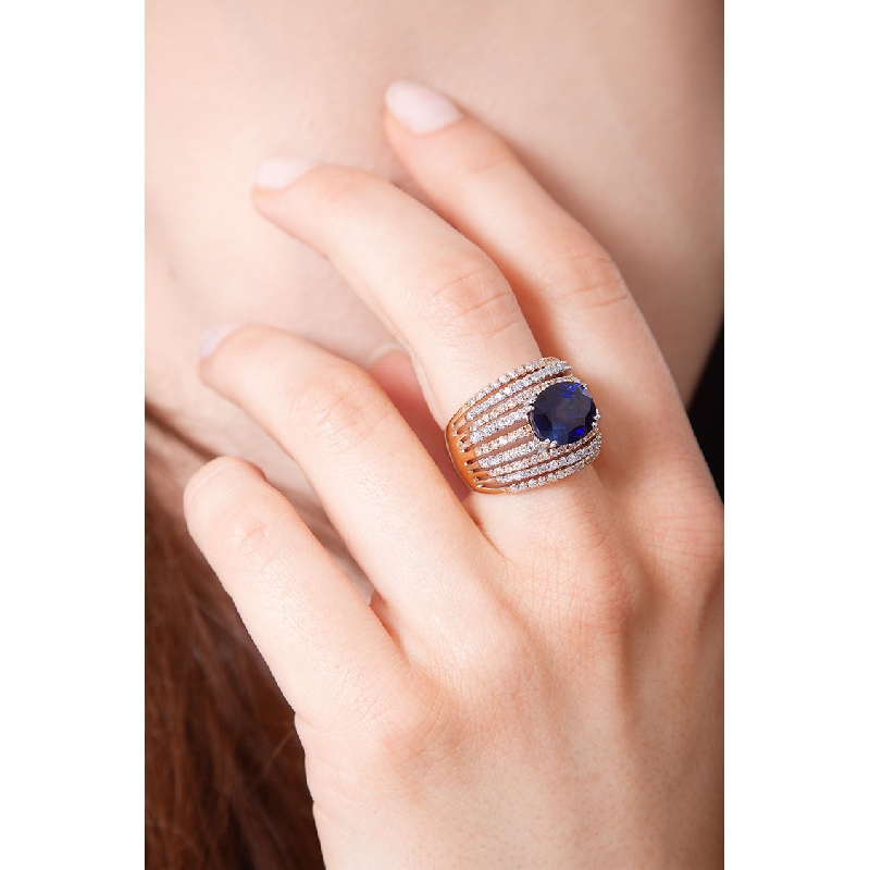 Band ring in white and rosé gold 18k with blue sapphire and diamonds 