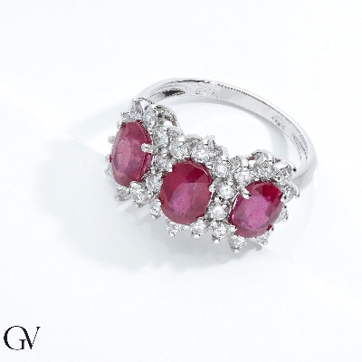 18k white gold halo ring with three rubies oval cut and diamonds 