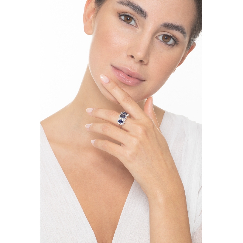 18k white gold halo ring with 3 Oval sapphires crowned by diamonds