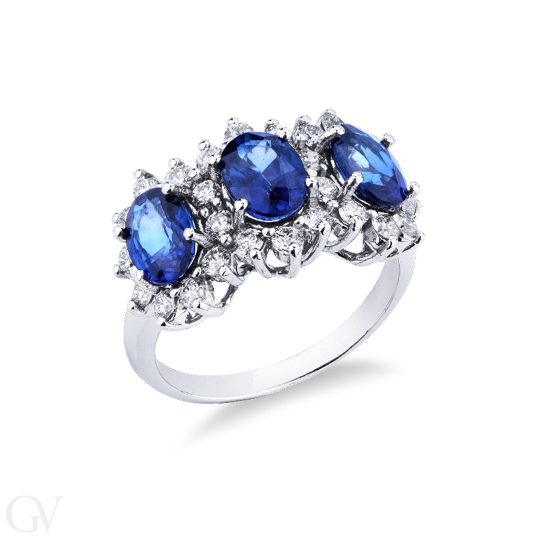 18k white gold halo ring with 3 Oval sapphires crowned by diamonds