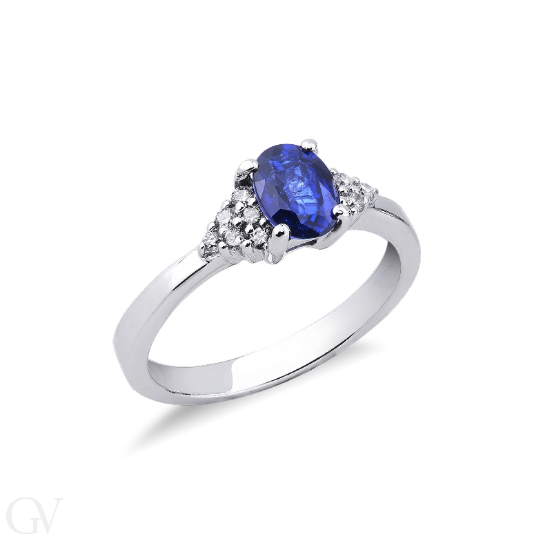 Ring with a central blue sapphire and six diamonds on each side