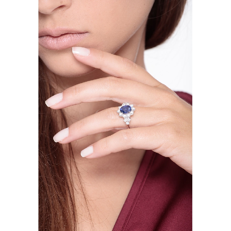 Halo ring with a blue sapphire and diamonds white gold 18k 