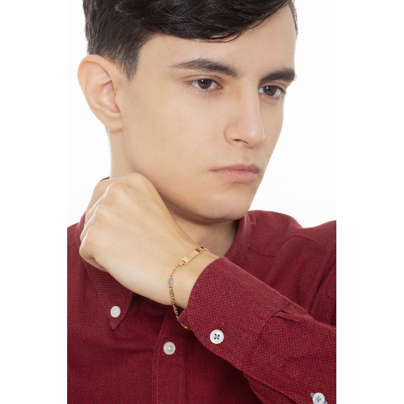 Bracciale in oro giallo e bianco 18k con piastrina incidibile.