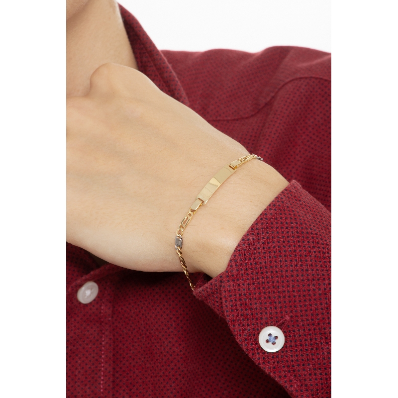 Bracciale in oro giallo e bianco 18k con piastrina incidibile.