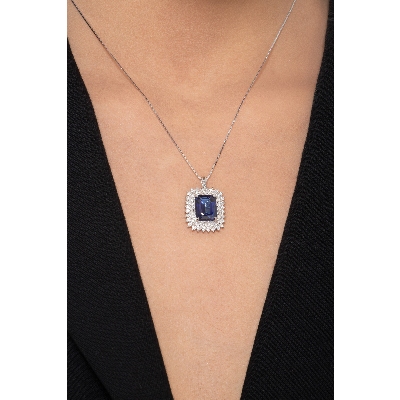Necklace with pendant, central emerald cut blue sapphire and round cut diamonds