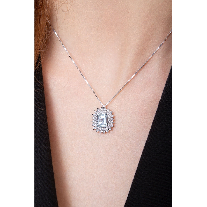Necklace with emerald cut aquamarine crowned by diamonds