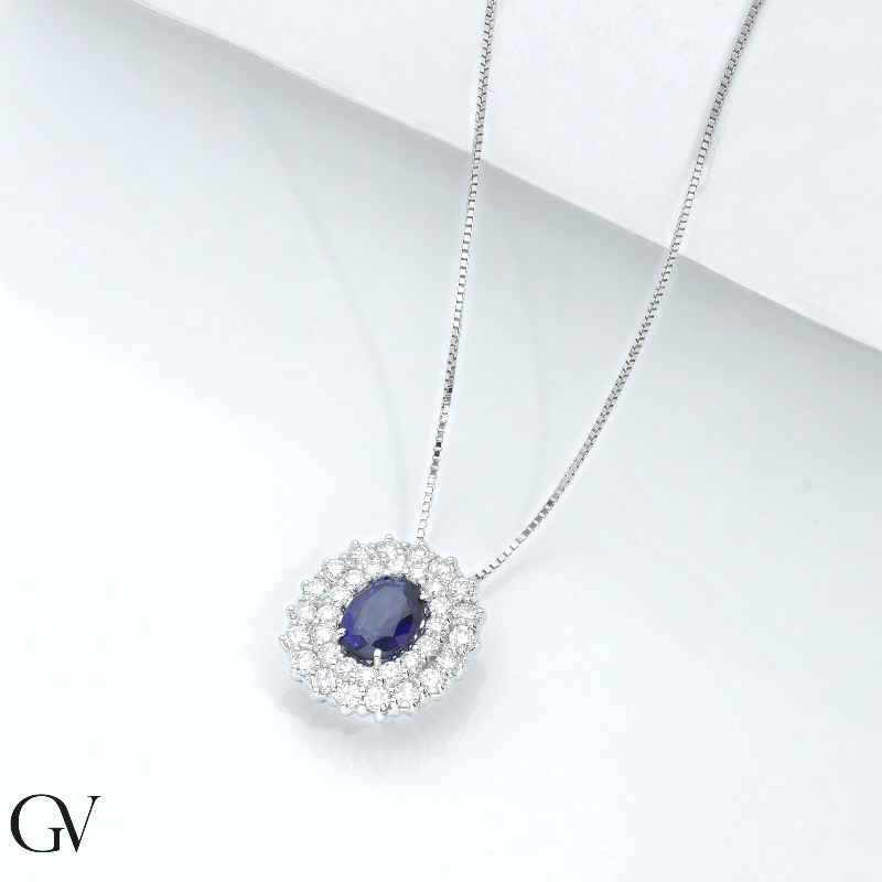 18k white gold double halo necklace with central blue sapphire and diamonds 