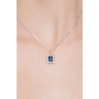 Necklace with pendant, central emerald cut blue sapphire and diamonds