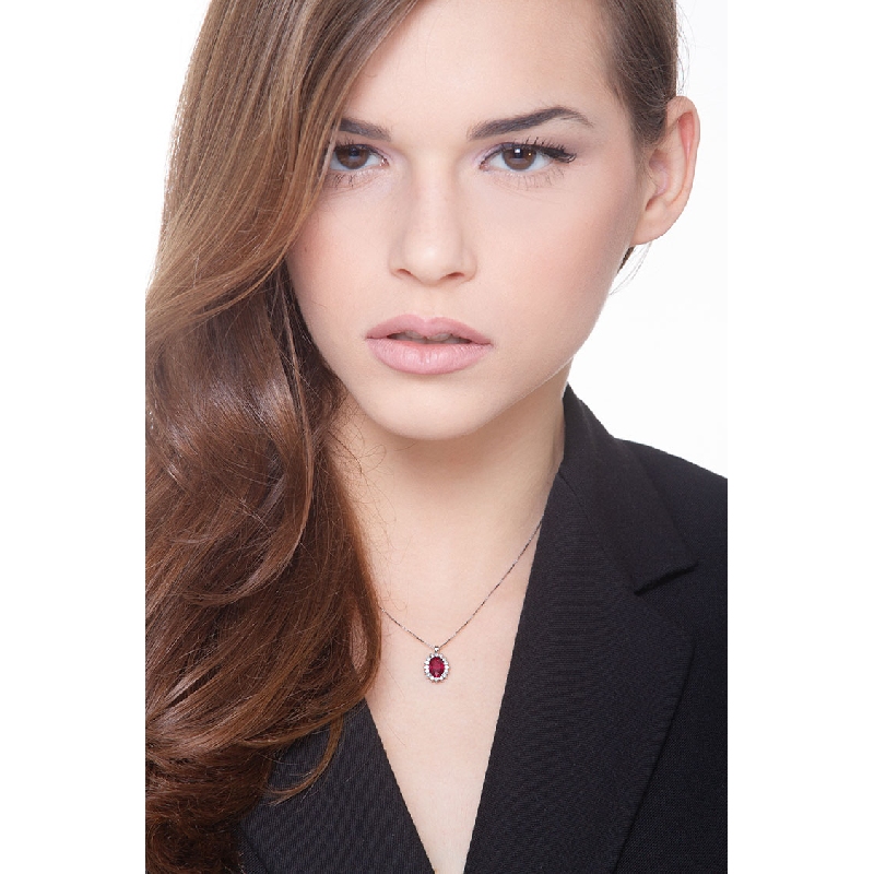 Necklace with central ruby and round cut diamonds