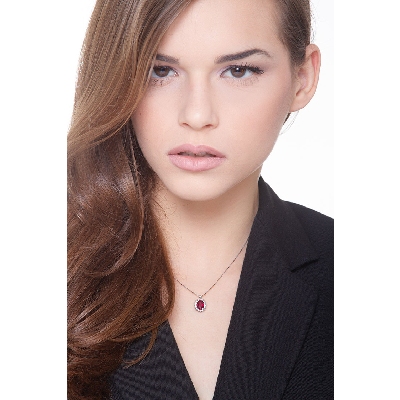 Necklace with central ruby and round cut diamonds