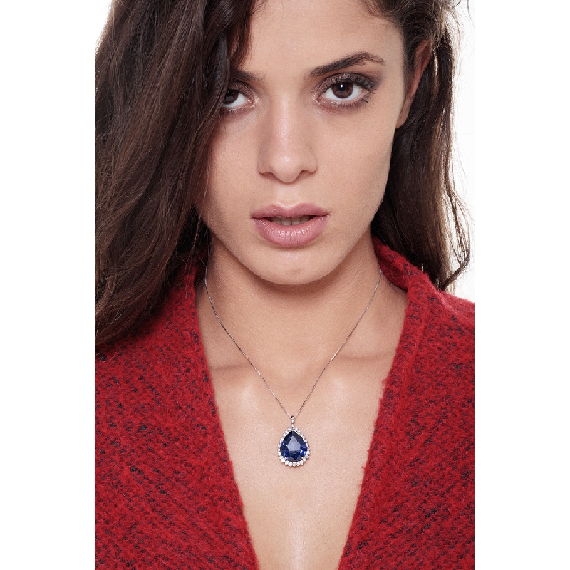 Necklace with pendant, pear cut blue sapphire and round cut diamonds