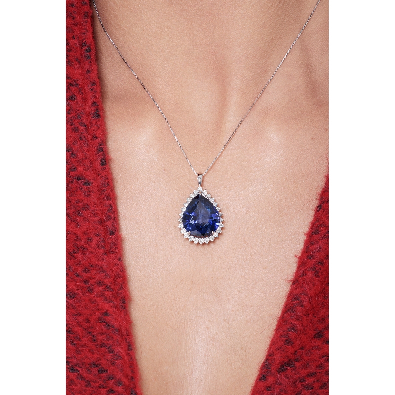 Necklace with pendant, pear cut blue sapphire and round cut diamonds