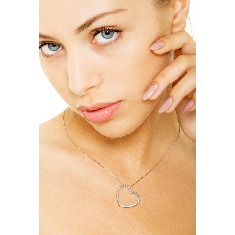 Inclined heart with round cut diamonds in white gold 18k