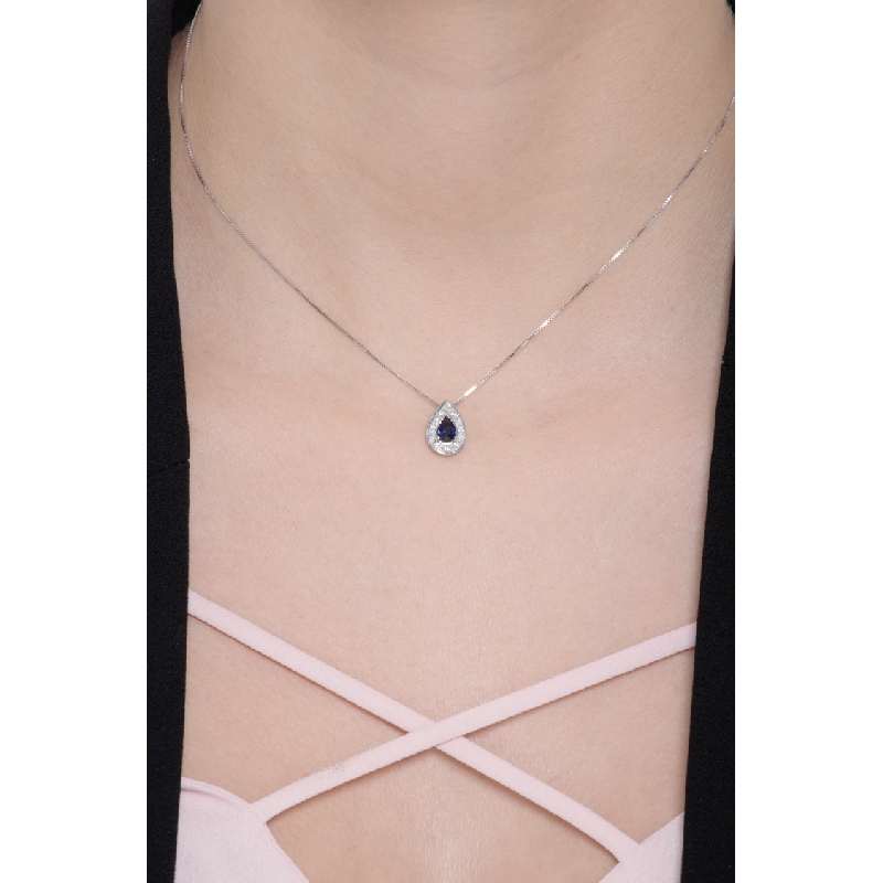 Necklace with pendant, diamonds and a pear cut blue sapphire