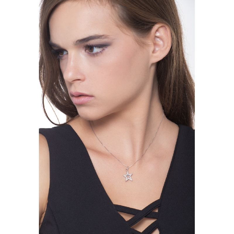 Star shaped pendant with round cut diamonds