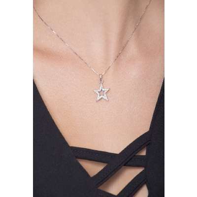 Star shaped pendant with round cut diamonds