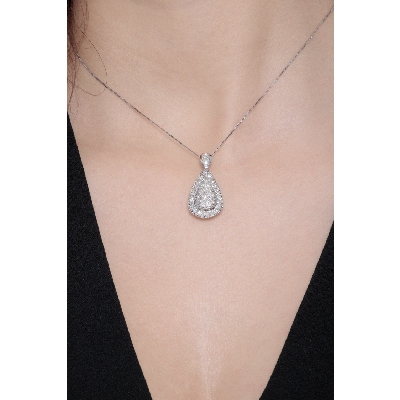 Elegant drop shaped pendant with round cut diamonds