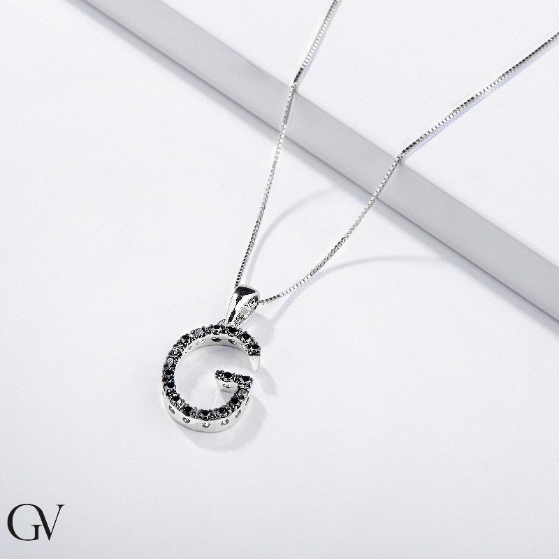 18k white gold letter G with black diamonds